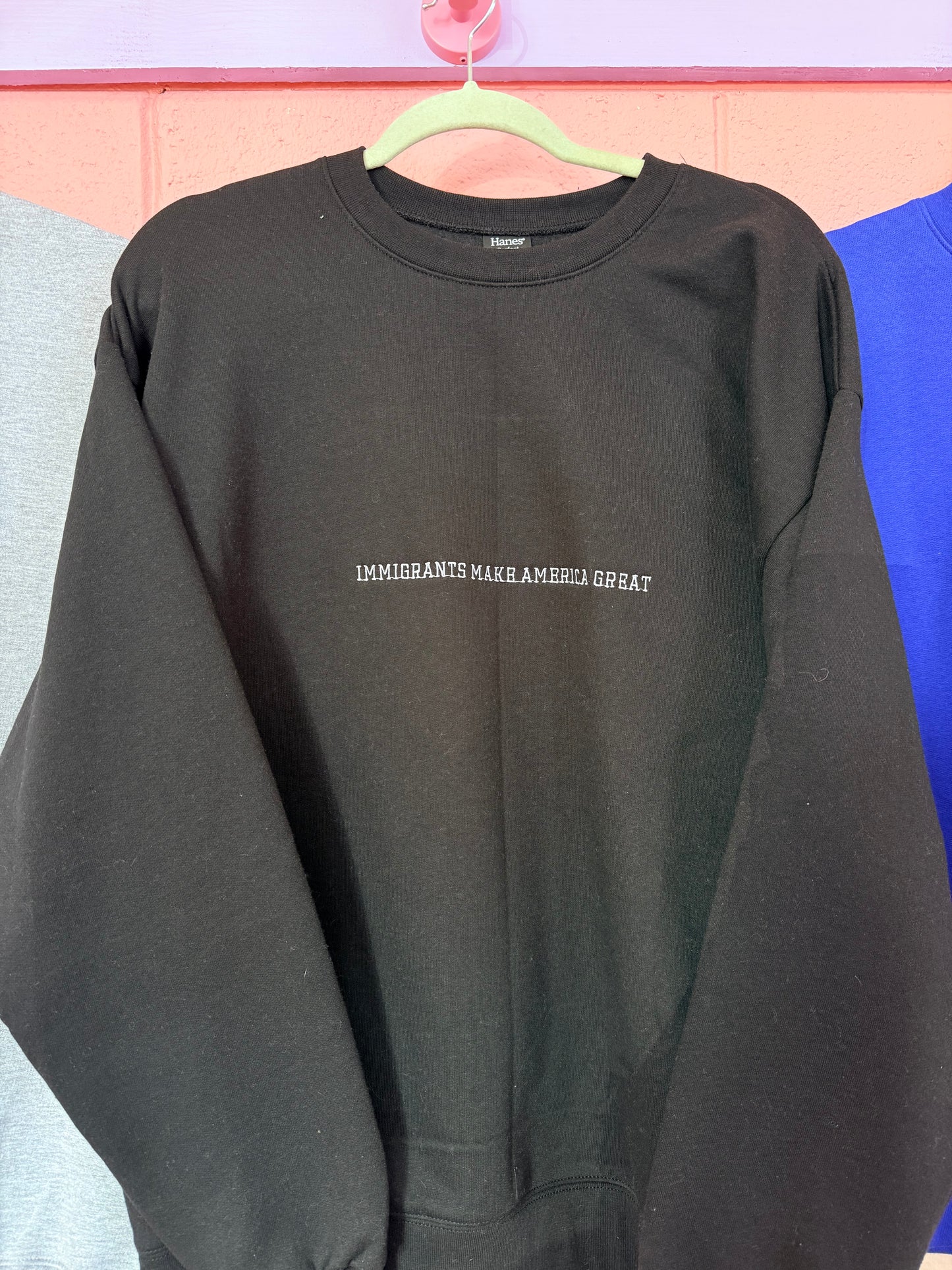 “Immigrants Make America Great” Embroidered Top