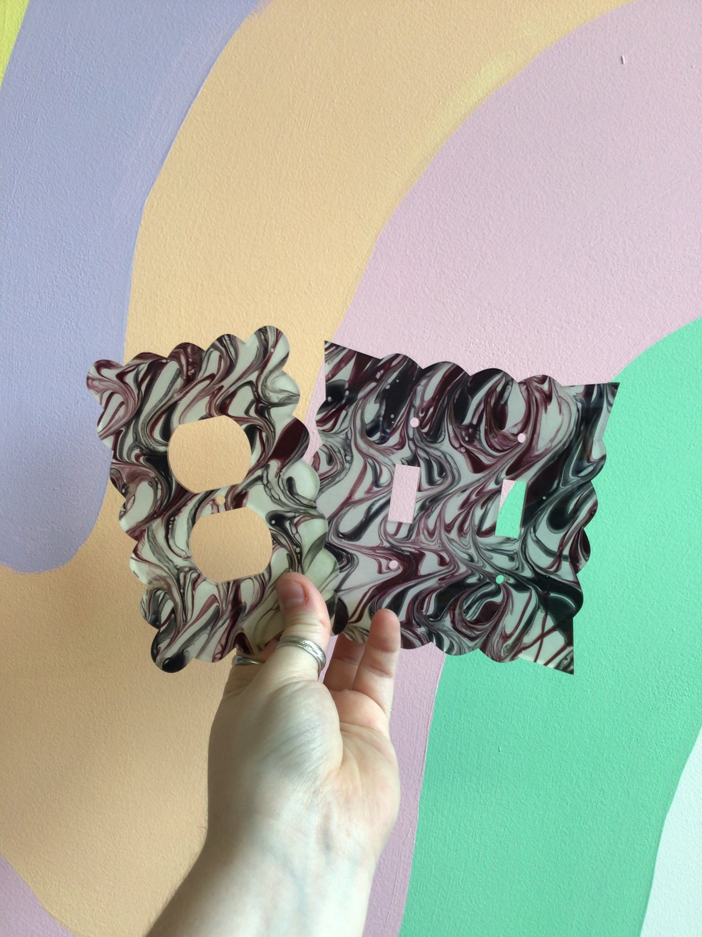 Raspberry and Black Paint Swirl Outlet Covers
