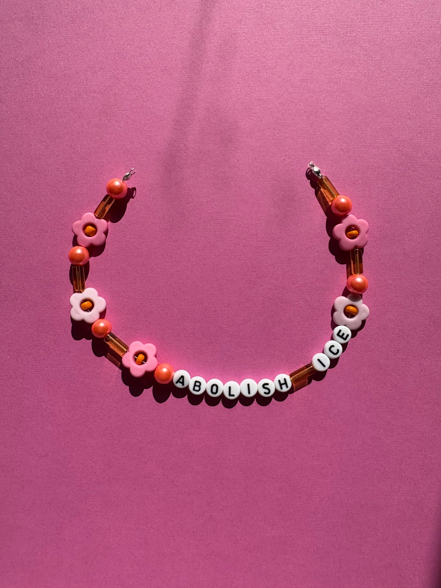 Abolish ICE pink orange and yellow bag or phone charm