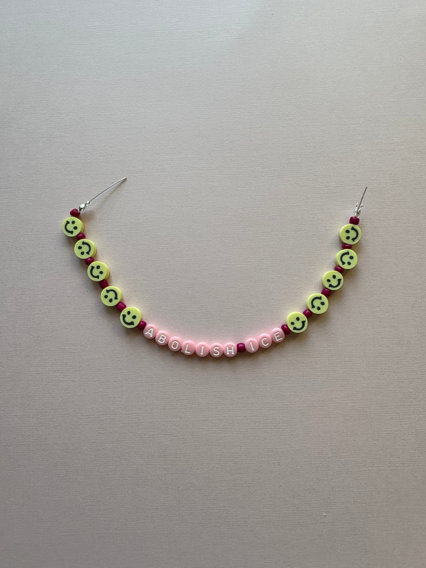 ABOLISH ICE smiley pink beaded phone charm or bracelet