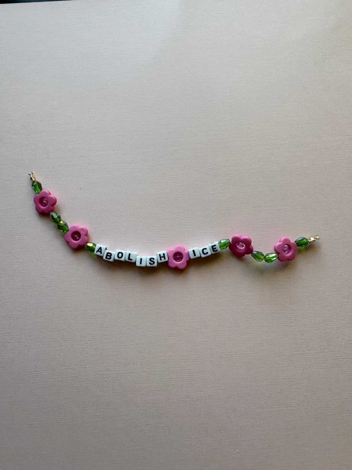 ABOLISH ICE pink flowers bracelet or phone charm