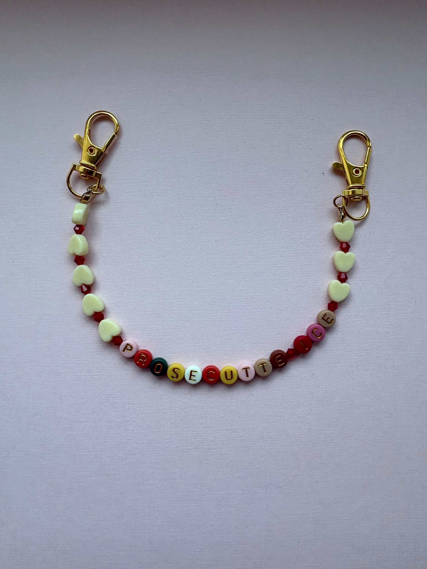 PROSECUTE ICE ivory heart patterned bag charm