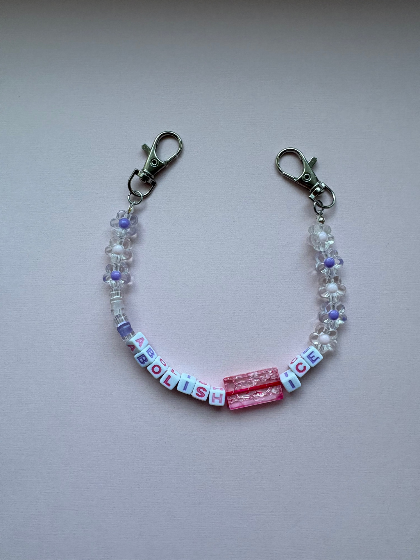ABOLISH ICE pink purple flower bag charm