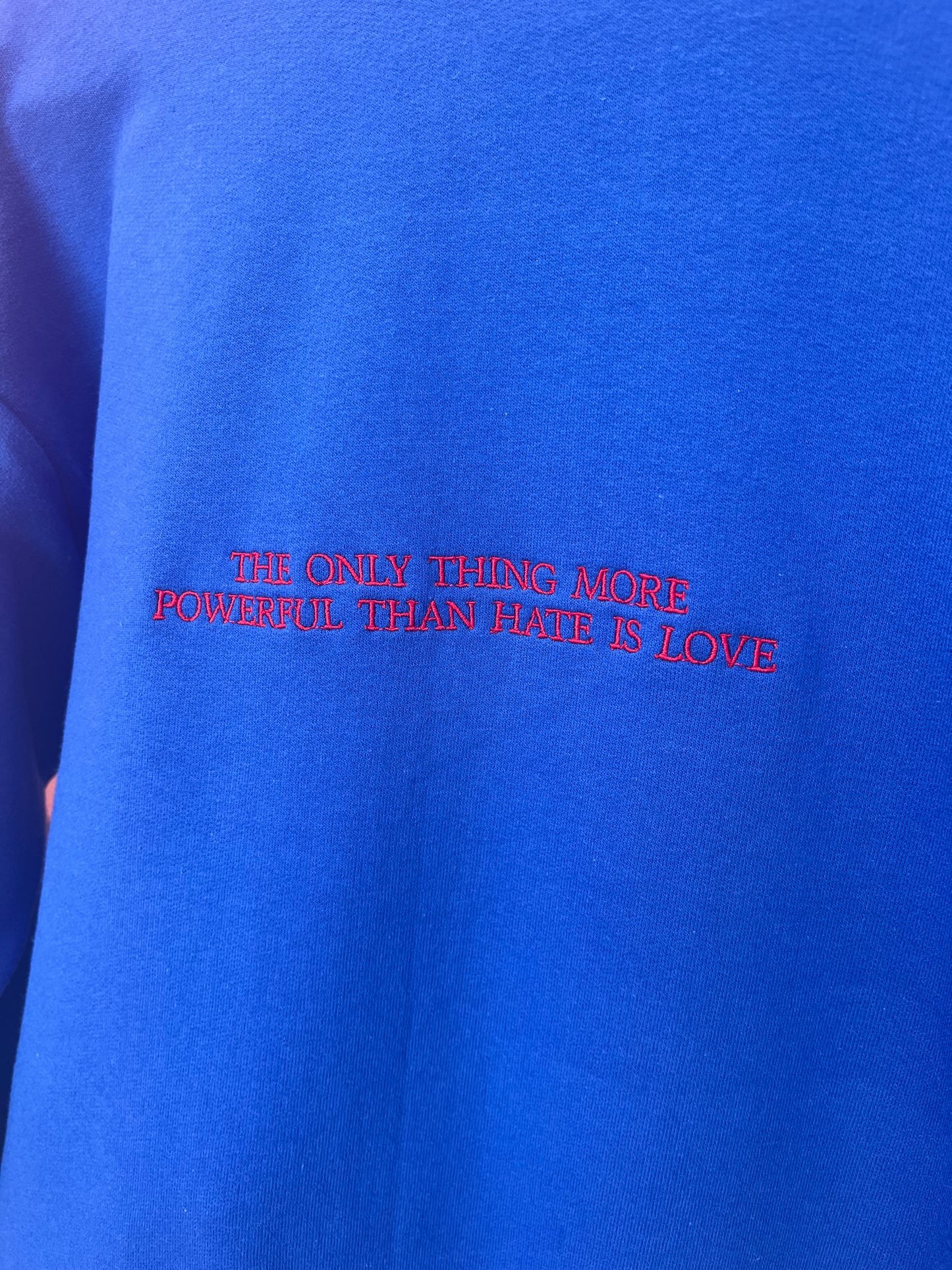 “The Only Thing More Powerful Than Love is Hate” Embroidered Shirt