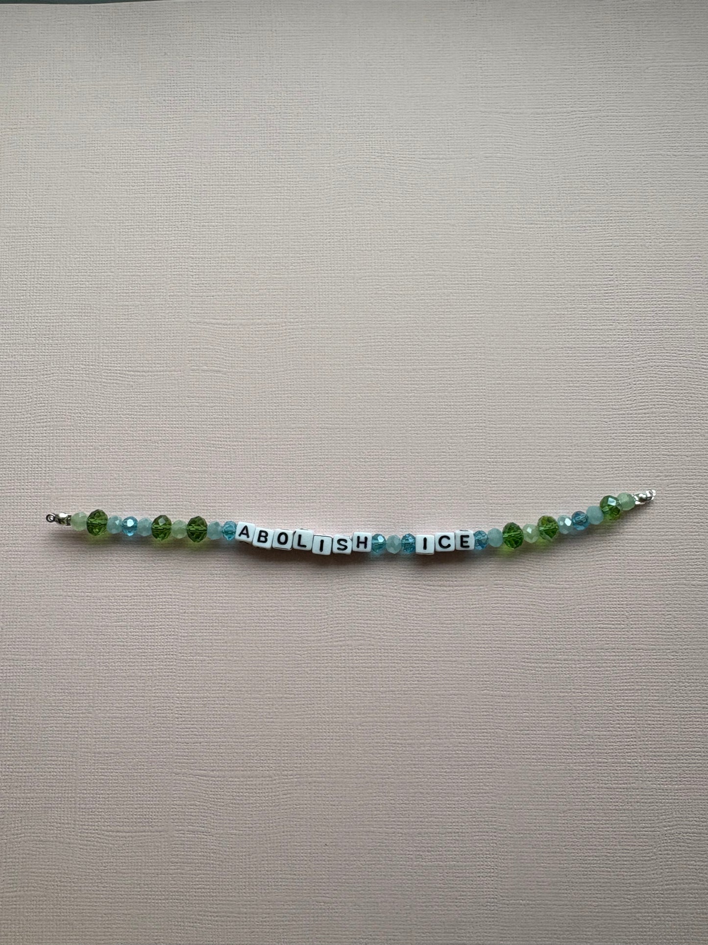Abolish Ice blue and green bracelet or bag charm