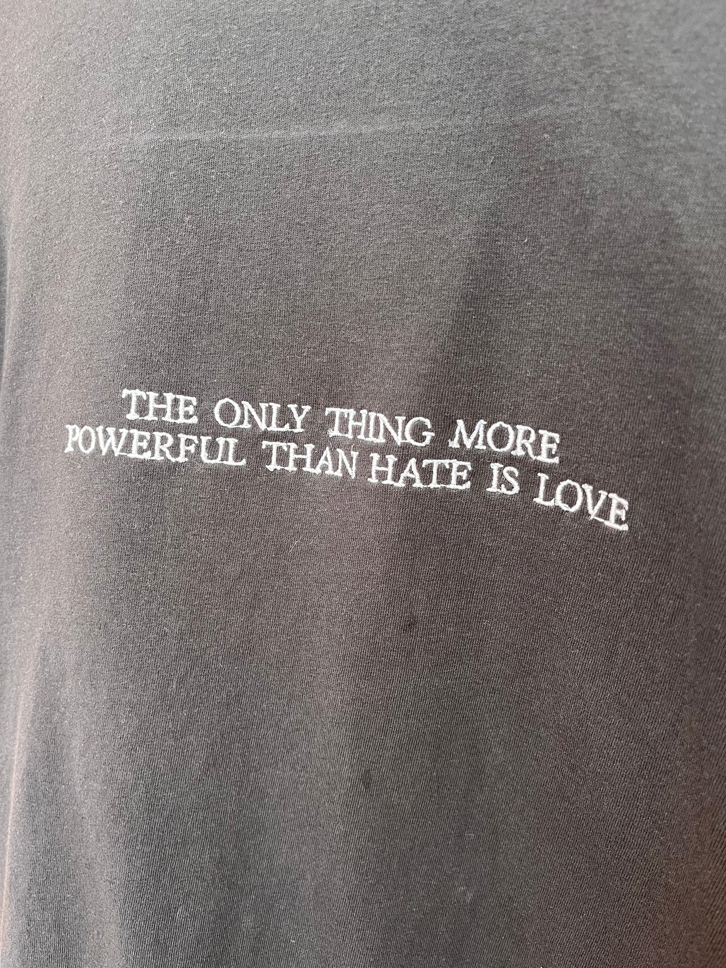 “The Only Thing More Powerful Than Love is Hate” Embroidered Shirt