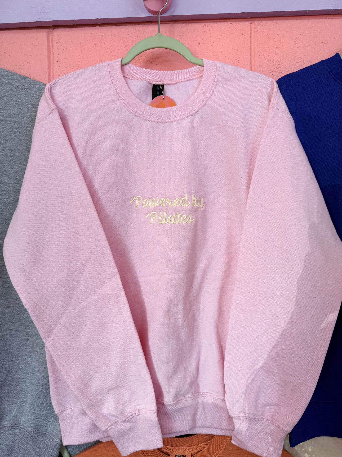 “Powered by Pilates” Embroidered Top