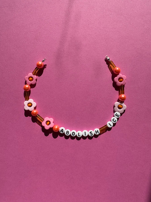 Abolish ICE pink orange and yellow bag or phone charm