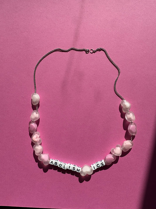Abolish ICE, pink heart necklace