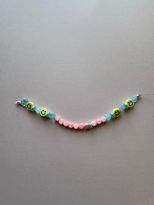 ABOLISH ICE smiley blue beaded phone charm or bracelet