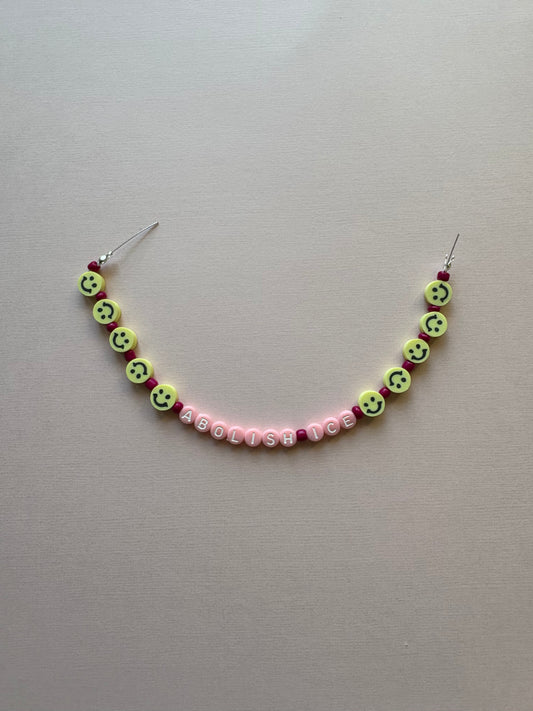 ABOLISH ICE smiley pink beaded phone charm or bracelet