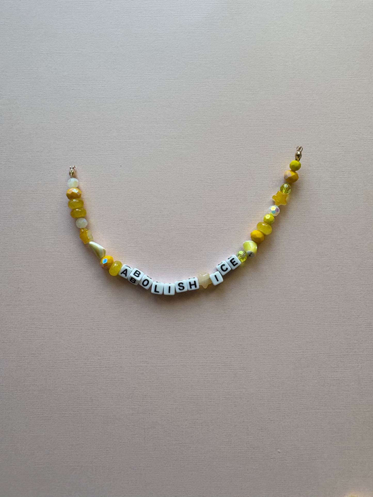 ABOLISH ICE yellow beaded phone charm or bracelet