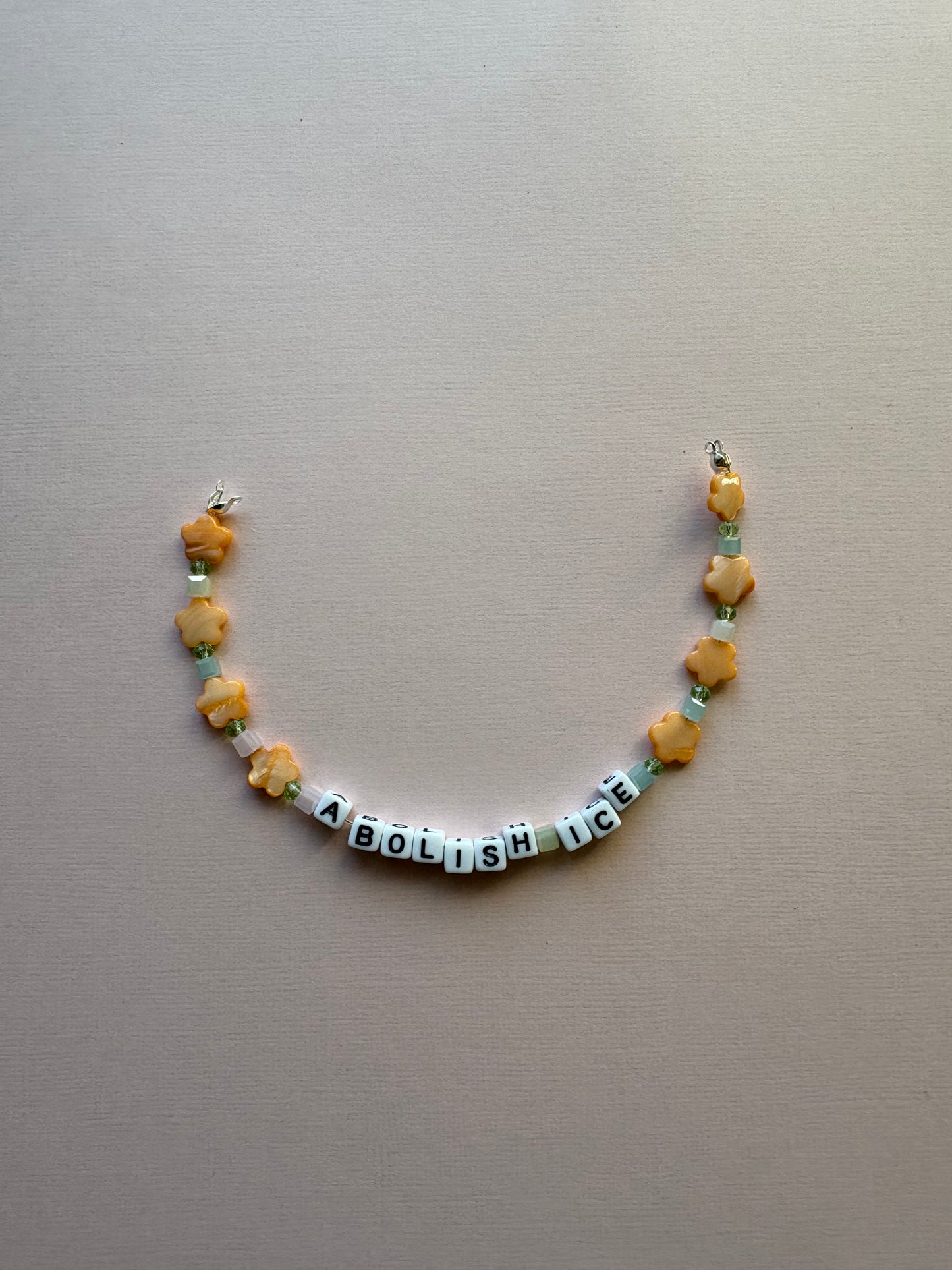 ABOLISH ICE orange flower bag or phone charm