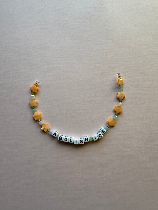 ABOLISH ICE orange flower bag or phone charm