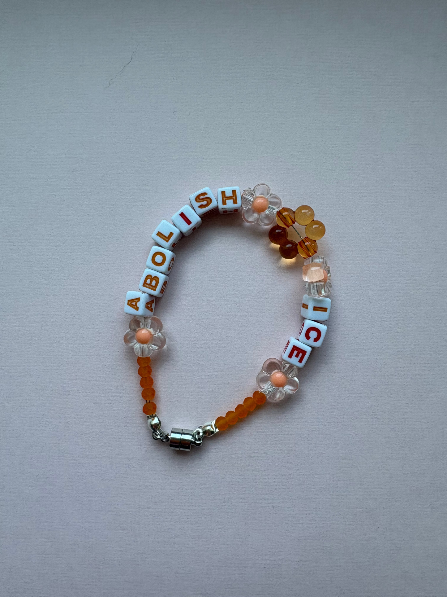 ABOLISH ICE orange beaded bracelet