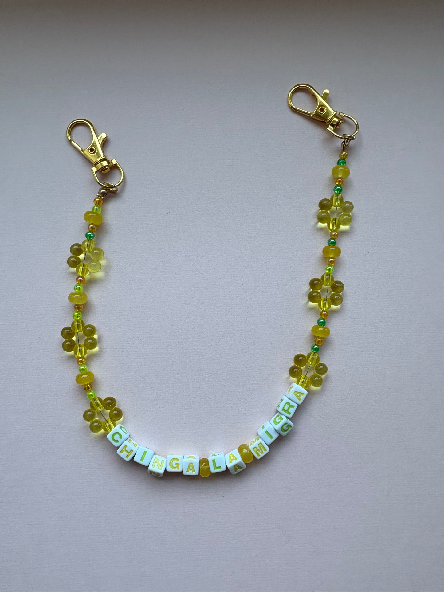 CHINGA LA MIGRA green and yellow flower bag charm