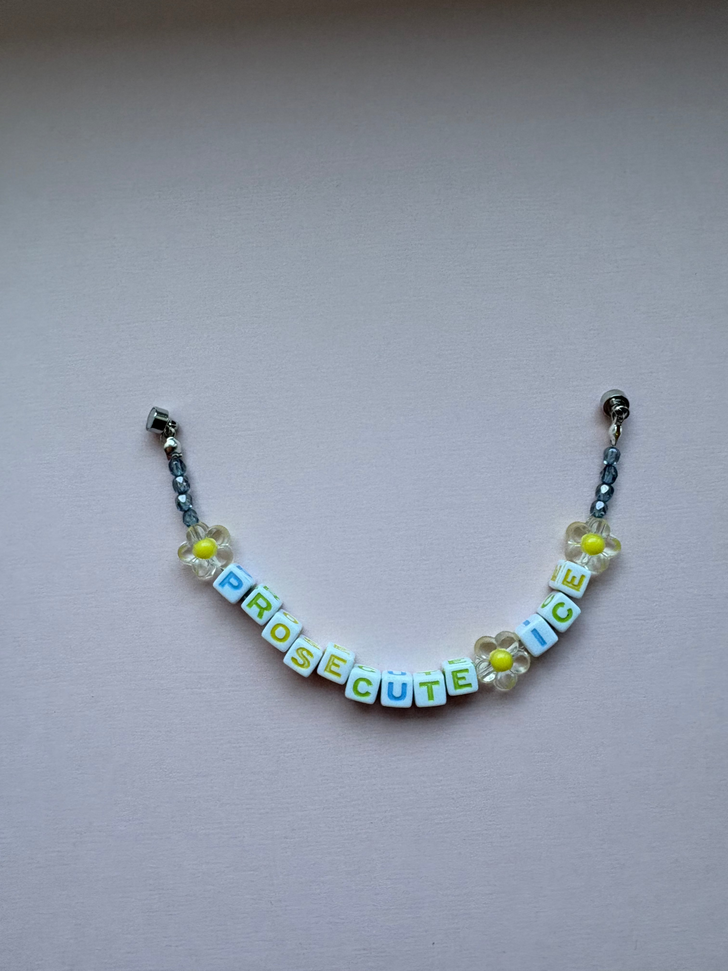 PROSECUTE ICE daisy and raindrop bracelet