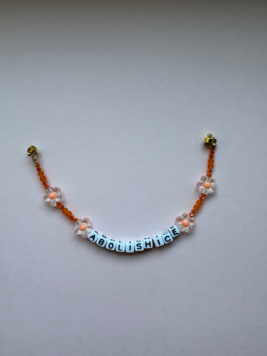 ABOLISH ICE orange flower bracelet