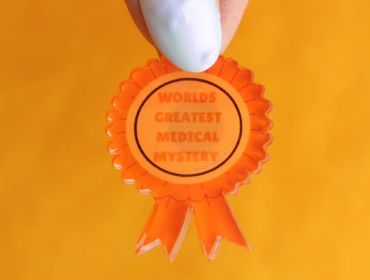 "World's Greatest Medical Mystery" Pin