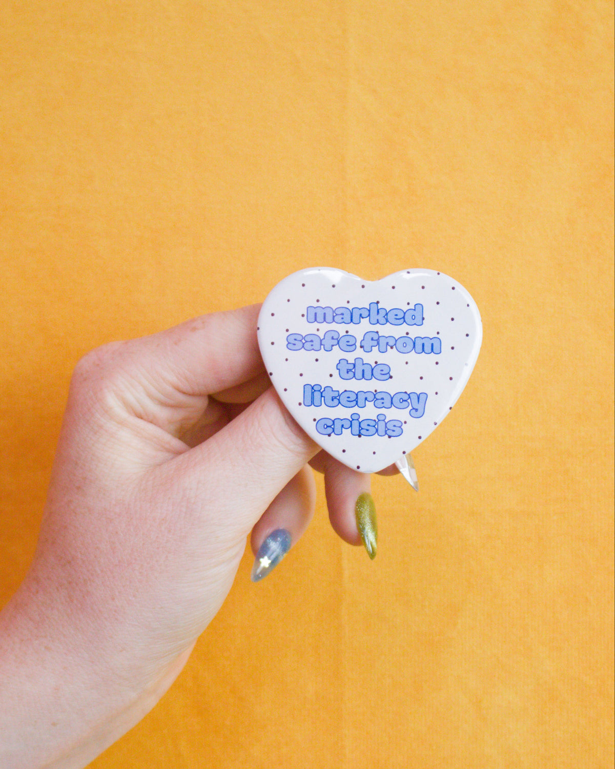 Marked Safe From the Literacy Crisis Heart Pin