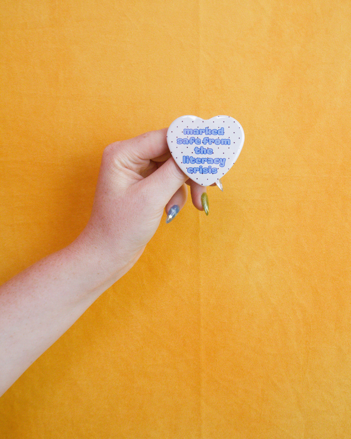 Marked Safe From the Literacy Crisis Heart Pin